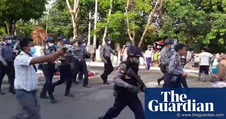Myanmar police confront protesters and fire rubber bullets – video