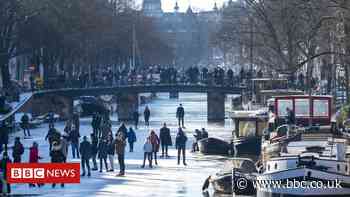 In pictures: Joy for Dutch as canals freeze over