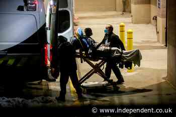 Texas hospitals evacuate patients as one county official seeks a refrigerated truck to store the dead