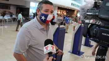 Ted Cruz arrives back in frigid Texas, admits plans were to stay in Mexico through the weekend