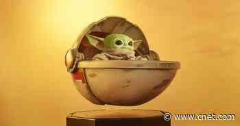 You can bid on a Baby Yoda plush with a floating pram     - CNET