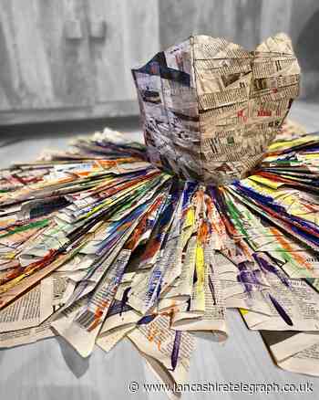 Whalley fashion designer makes newspaper dress to express hope in pandemic