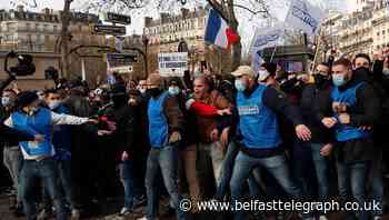 Protesters oppose move to disband French anti-migrant group