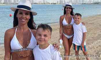 Danielle Lloyd flaunts her figure in a white bikini as she poses with son in throwback Dubai snap