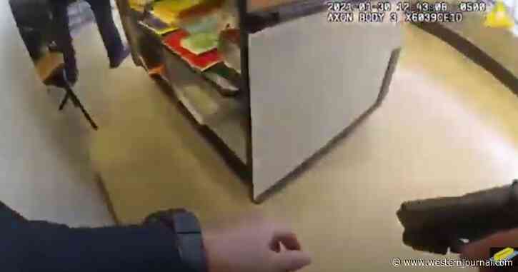 Watch: Cops Caught in Supermarket Shootout with Security Guard