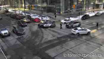 Police close downtown Toronto street as bottles are thrown from balcony of building