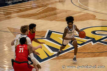 Men's basketball tops Rhode Island for first win after pause - GW Hatchet