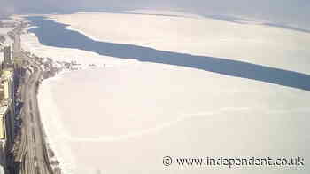 Huge ice sheet breaks off Lake Michigan shoreline