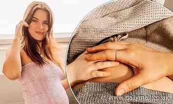Pregnant Binky Felstead shares a sweet snap holding her daughter India's hand over her baby bump