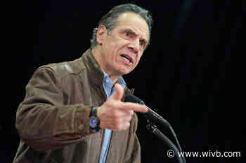 Former aide says Cuomo kissed her, suggested strip poker