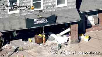 Vehicle Crashes Into Building, Causing Heavy Damage