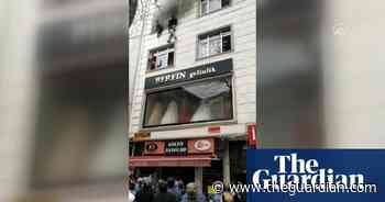 Mother throws children to safety from burning building in Istanbul