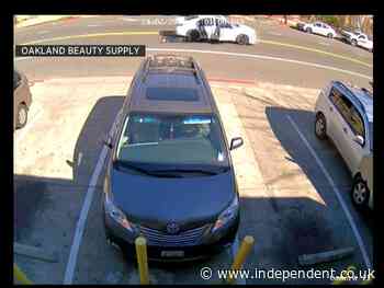 Woman dragged along road by car after being robbed