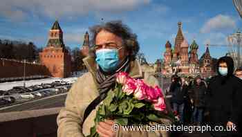 Russians lay flowers to mark opposition leader’s killing