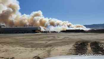 Firefighters battle flames at local almond hulling facility
