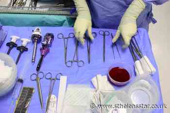 Doctor appears in court video call while performing surgery - St Helens Star