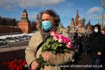 Russians lay flowers to mark opposition leader's killing - St Helens Star
