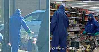 Shoppers in hazmat suits take no chances during Waitrose visit