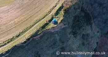 Family camping on dangerous cliff edge sparks coastguard warning