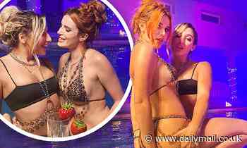 Bella Thorne poses in leopard print bikini as she shares BTS snaps from Shake It with Abella Danger