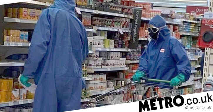 Couple spotted at Waitrose in full hazmat suits, rubber gloves and goggles