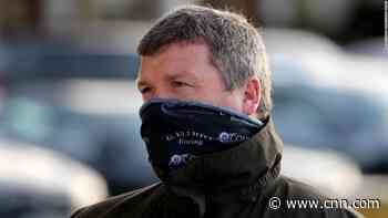 Top racing trainer apologizes over photo of himself sitting on a dead horse