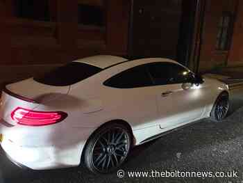 Driver arrested in Bolton after moving into passenger seat