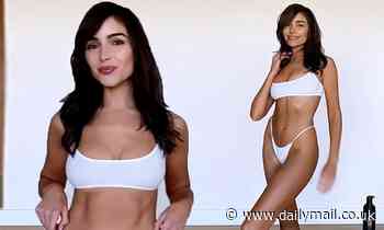Olivia Culpo applies a fake tan in a white bikini after detailing endometriosis scare
