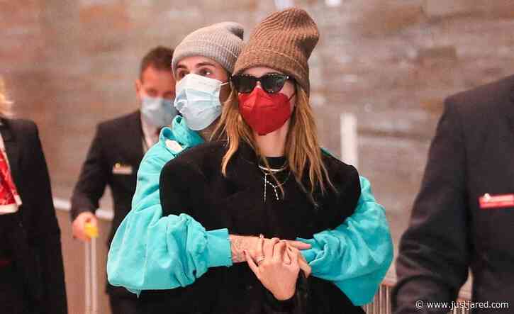 Justin & Hailey Bieber Cuddle Up in the Airport While Leaving Paris