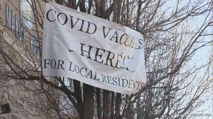 Signs For COVID Vaccine Become Sticking Point Between Aurora Clinic And The City