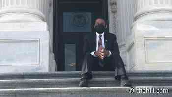 House Democrat sits on Capitol steps to protest extremist threat