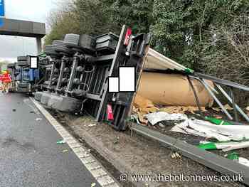 Delays as HGV overturns on motorway