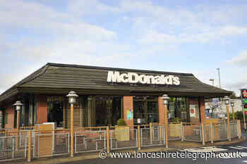 Brandy drinker's car rolled into police vehicle at McDonald's drive-thru