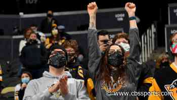 Penguins admit they edited masks onto fans for social media post