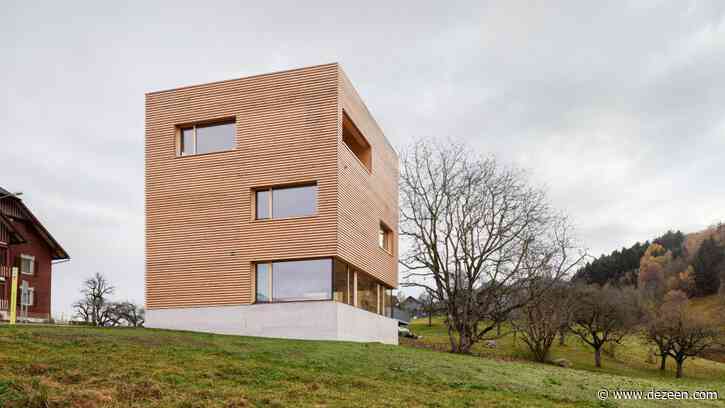 Haus im Obstgarten is a geometric timber house in a traditional Austrian village