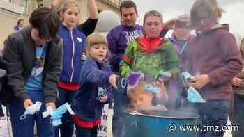 Idaho's #BurnTheMask Rally Sees Kids Tossing Face Masks Into Fire
