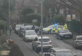 Driver crashes into parked cars outside Bolton primary school