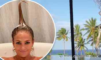 Jennifer Lopez shows off her VERY silly hairstyle as she takes a bath