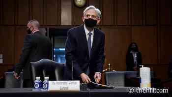 Political landmines await Garland at DOJ
