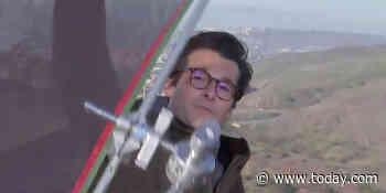 Watch NBC News' Jacob Soboroff block falling equipment during live report