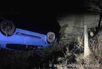 Car found abandoned on its roof off Bury Road, Turton