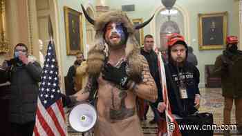 'QAnon shaman' must remain in jail, judge rules