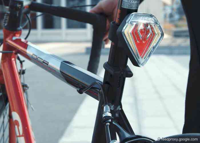 Shield bicycle taillight features brake light, turning lights, alarm and more