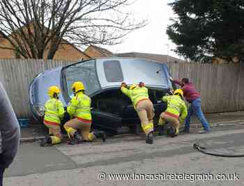 Little Harwood passers-by rush to help woman trapped in flipped car