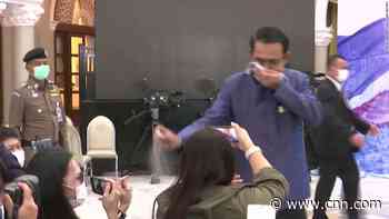 See Thai PM spray journalists with sanitizer at news conference