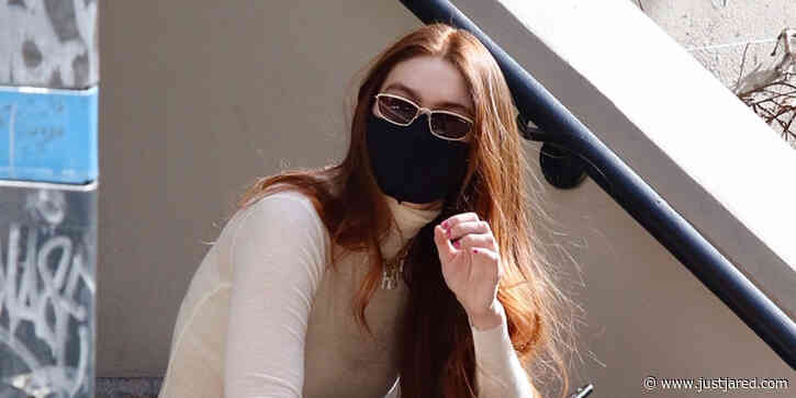 Model Gigi Hadid Chills Out on Stoop After Business Meeting