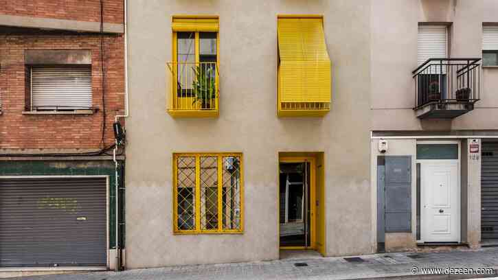 Anna and Eugeni Bach create Barcelona apartment building with bright yellow balconies