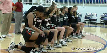 Announcer uses racial slur after high school basketball team kneels during anthem