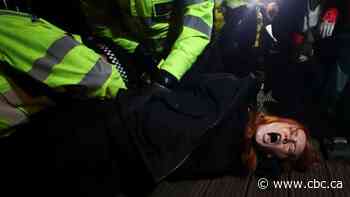 London police clash with attendees at Sarah Everard vigil