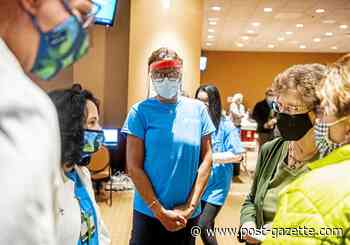 She can't travel. So this retired Pittsburgh-area nurse is giving shots to help end the pandemic